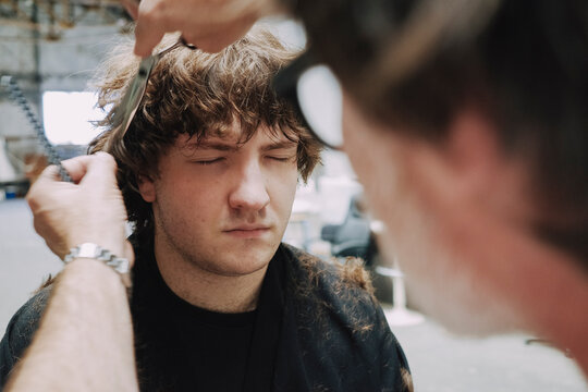 Hair Styling Process in a Creative Studio Setting