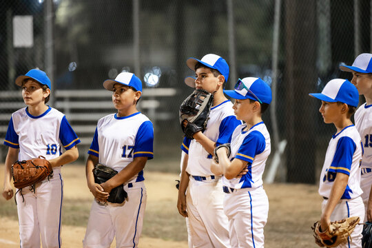 Players Listen to Coach During Team Talk