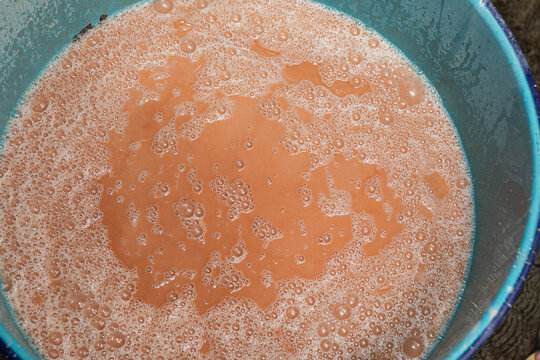 Foamy mixture of popo, a cacao and corn drink