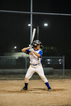 Baseball Player Prepares to Bat 