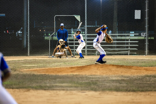 Pitcher Throws Baseball towards the batter