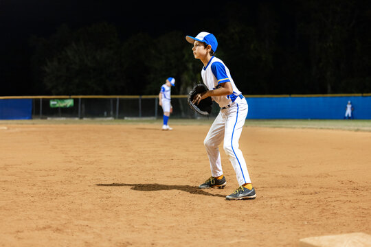 Nighttime Baseball by Young Players
