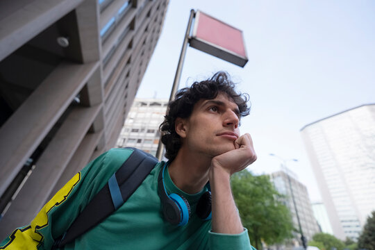 Gen Z traveler thinks while waiting for metro in Italy