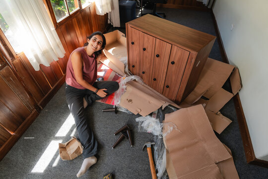 ugc woman unboxing New Furniture Delivery at Home

