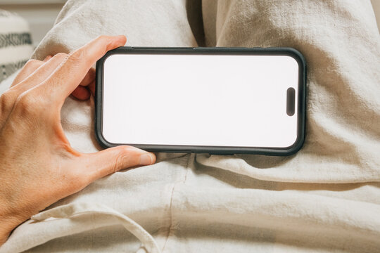POV hands holding blank horizontal phone screen 