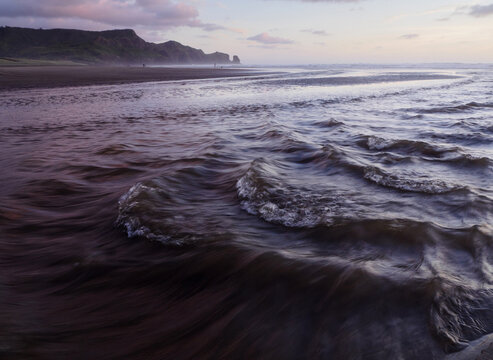 River flowing out to beach 