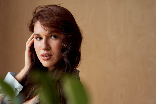 Portrait of brunette woman looking at camera