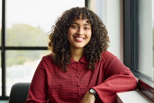 Smiling Woman in Modern Office