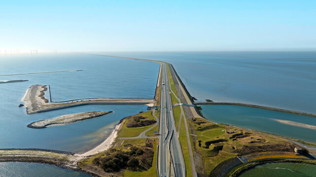 Coastal dam with highway and ecological waterway infrastructure in Europe
