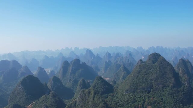 Dramatic Karst Mountain Landscape Under Blue Sky