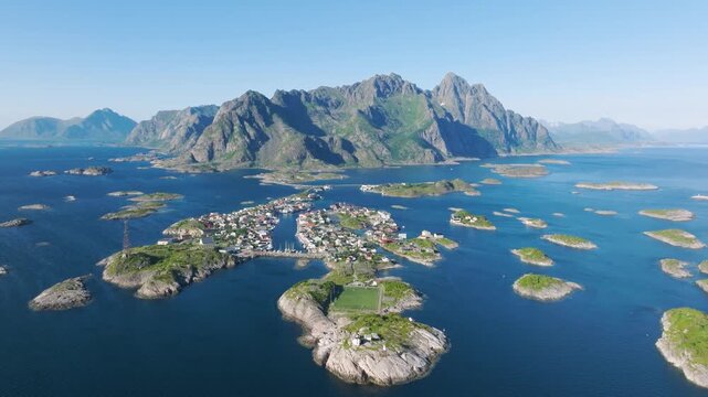Aerial drone view of Henningsvaer village in Lofoten islands, Norway. Scenic summer video with mountains, islands and ocean. A famous place. Travel and vacation in Scandinavia.