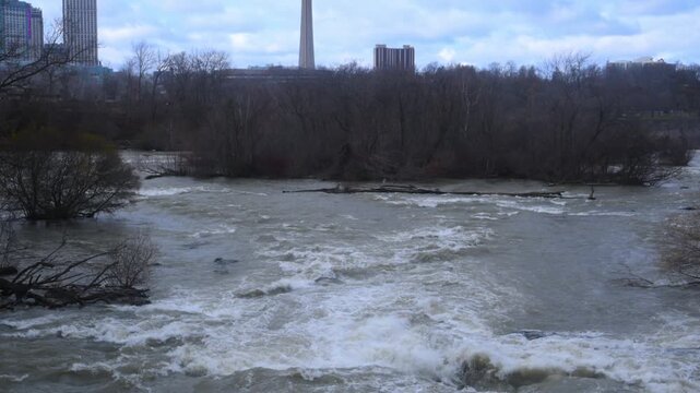 This video appears to show the upper rapids of Niagara Falls with the Skylon Tower visible in the background.