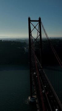25 de Abril Bridge Cinematic Drone Footage Above the Tagus River in Summer. Lisbon Portugal