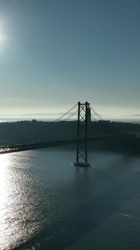 25 de Abril Bridge Cinematic Drone Footage Above the Tagus River in Summer. Lisbon Portugal