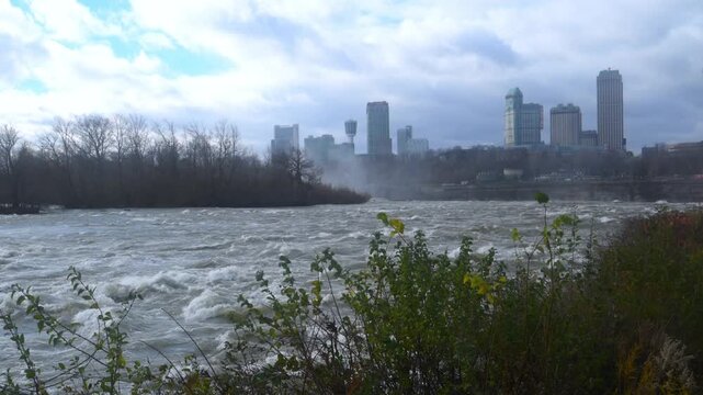This scene shows the roaring rapids of the Niagara River leading to the iconic Niagara Falls.