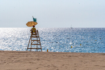 Lifeguard surveying ocean from tower on beach © Ernesto Sevilla