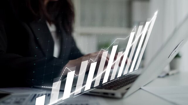 A businesswoman engages with her laptop while analyzing financial data, highlighted by a digital graph overlay. This image symbolizes growth and progress in the corporate world. Copula