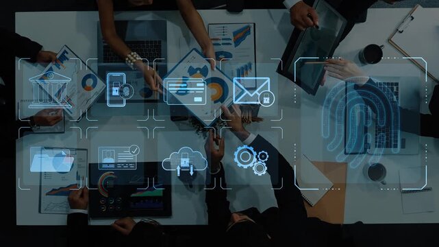 Captivating overhead view of a business meeting integrating digital technology and graphic analysis, emphasizing teamwork and innovative strategies for success. Raster