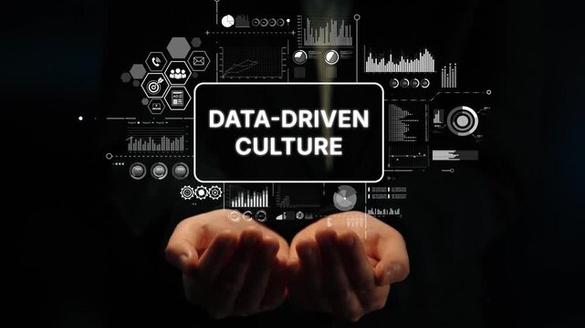 Hands Holding Text Representing Data-Driven Culture with Digital Interfaces and Analytics Graphics. Asymptotic smart data analytic.