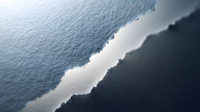 Abstract background featuring a sharp diagonal tear across a textured dark blue paper surface with soft bright white lighting depth