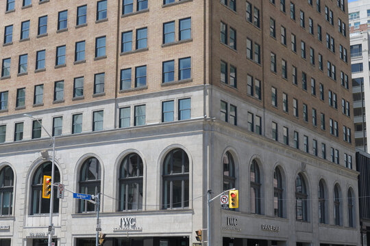 exterior building facade and sign of IWC Schaffhausen Boutique, a watch store, located at 170 Bloor St W, Floor 1 of Park Hyatt, Toronto