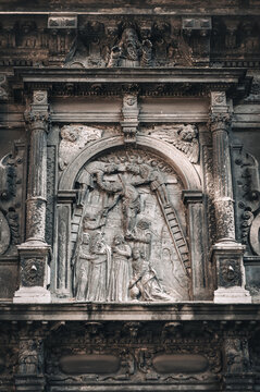The old faзade of the Boim Chapel in Lviv. Reliefs from the life of Jesus Christ on the walls of medieval Eastern European architecture. The biblical story of the descent from the cross.