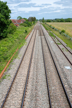 Double-track railway main line running straight through countryside near Ashchurch, Tewkesbury, Gloucestershire