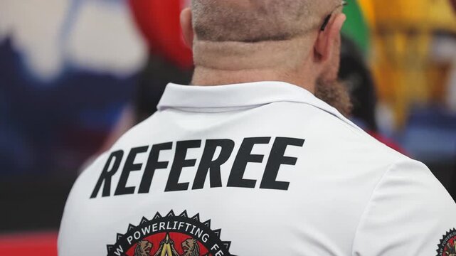 Russia, St. Petersburg, August 8, 2020 A close-up shot of a man's chest and torso, wearing a referee shirt