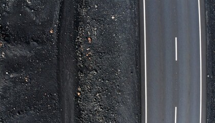 Fototapeta premium Rough dark asphalt road texture with white edge marking line