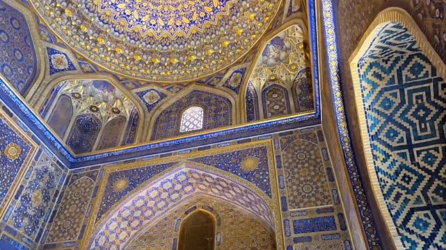 Interior pan shot of the golden Tilya-Kori Mosque in Samarkand