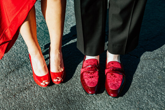 Close up of couple's red shoes, dressed up