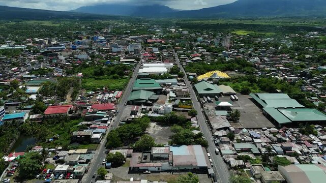 Aerial view of Tabaco City, Philippines with mountains in the horizon. Ideal for urban concepts.