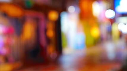 Abstract blurred colorful night street background with bright bokeh light circles © josh