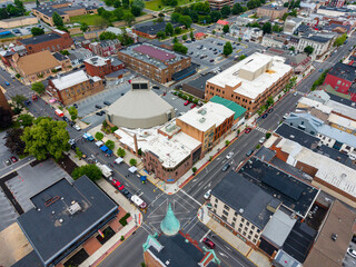 Fototapeta premium Aerial view of the Food Truck Festival and cityscape in downtown area. 
