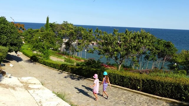 Two little beautiful girls in Nesebar, Bulgaria