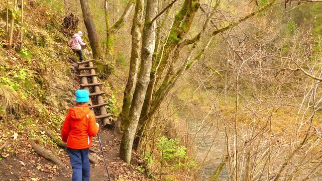 Two little beautiful girls walk in Slovak Paradise. Slovak Paradise (Slovensky raj) is mountain range in eastern Slovakia, part of Spis-Gemer Karst, located between towns of Spisska Nova Ves.