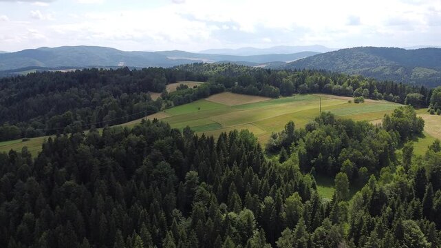 Aerial view of EuroVelo 11 bike path along Poprad river in summer, drone shot of scenic cycling route between Krynica-Zdroj, Muszyna and Rytro in Beskid Sadecki mountains, Poland.
