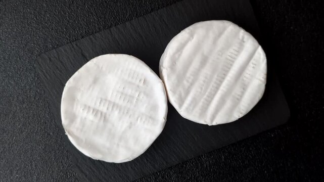 Brie or Camembert cheese is a white, round shape for baking and melting. Camembert cheese as a food background for your design