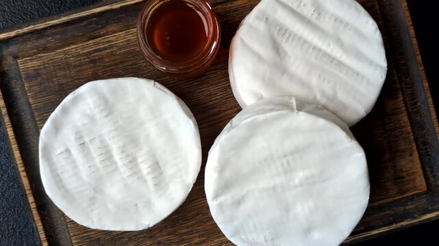 Brie or Camembert cheese is a white, round shape for baking and melting. Camembert cheese as a food background for your design