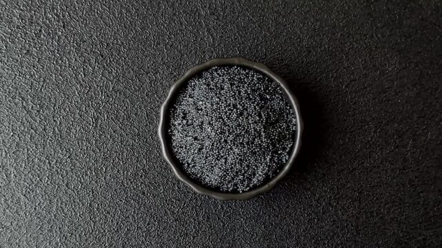 Black caviar from beluga or sturgeon, an expensive delicacy for sandwiches. Black caviar as a food background for your design