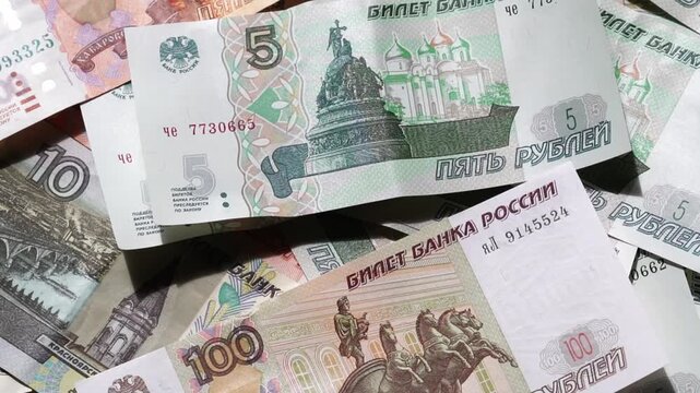 Paper banknotes of Russian rubles of different denominations in a stack close-up