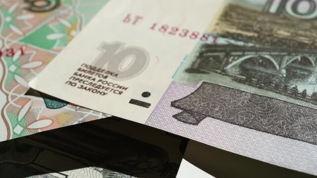 Paper banknotes of Russian rubles of different denominations in a stack close-up