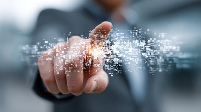Hand releasing digital particles representing workforce transformation and technology innovation