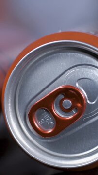 Opening a can with slow motion focus on the details of the tab