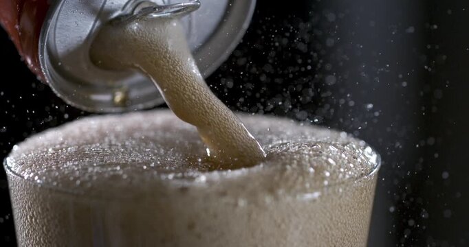 Watch this drink pour in slow motion with detailed action and bubbles