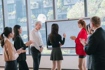 Obraz premium Business meeting office presentation teamwork collaboration digital whiteboard professional diverse group modern workspace discussion businesswoman businessman casual business attire technology