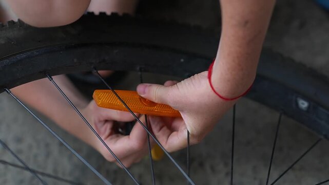 Bicycle wheel light reflector installation. Preparing your bike for the season. Updating parts, riding safety. Installing reflectors on wheels