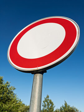 No Entry Traffic Sign Against Clear Blue Sky