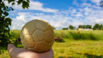 Fototapeta premium A four design bun in the form of a soccer ball with chocolate. World Cup 2026 in different spheres of life. Food for fans. 