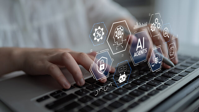 A close-up view of hands typing on a laptop keyboard while AI agents icons are displayed on the screen, symbolizing the integration of technology in modern workspaces. Entropy.
